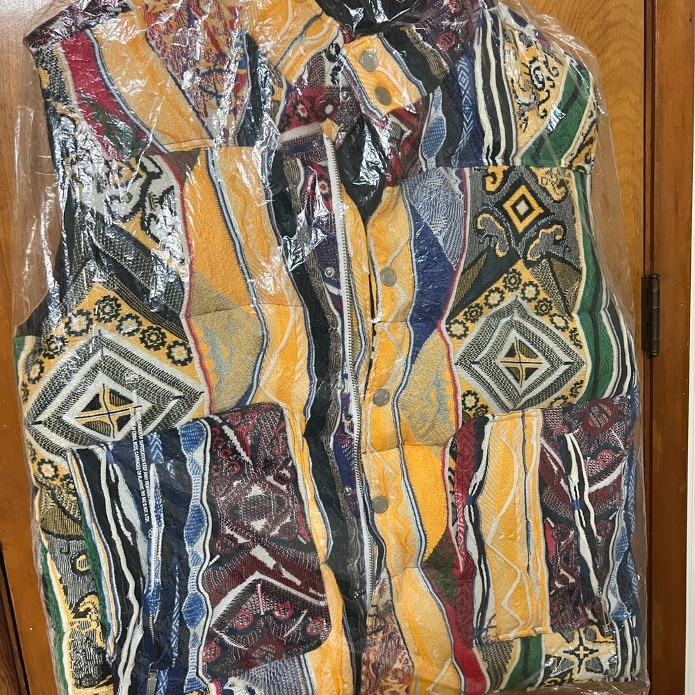 I have a brand new in the plastic Coogi sweater sz 3X. All tags attached. New.